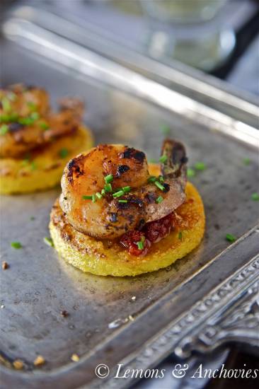 Prawns on crisp polenta rounds and sun-dried tomato dipping ...