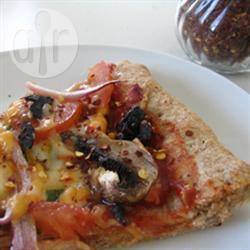 Volkoren pizzabodem met honing recept